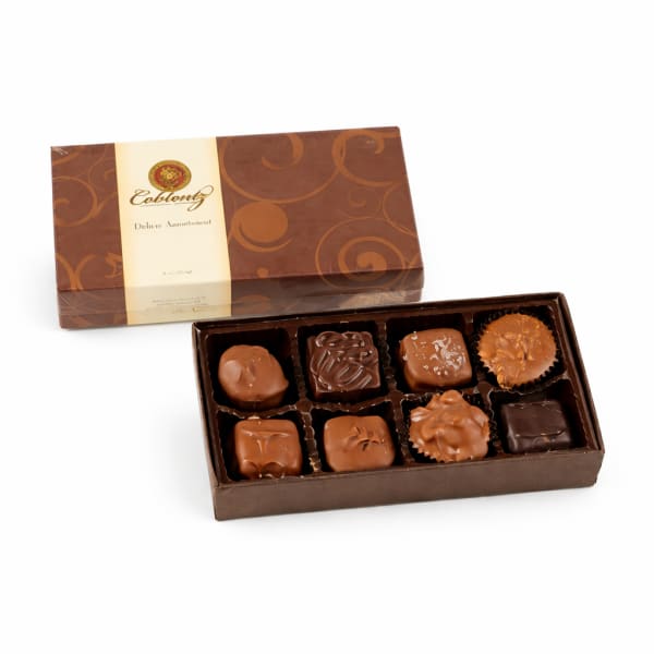 Box of assorted chocolates with a decorative lid