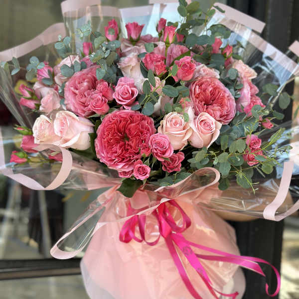 Pink rose bouquet with eucalyptus and ribbon wrap