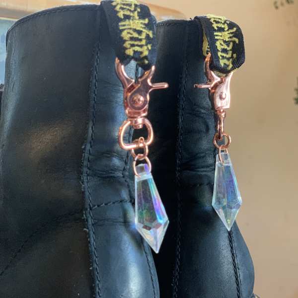 Black boots with dangling crystal charms