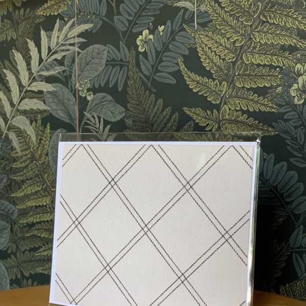 Blank plaid greeting card in a clear plastic sleeve