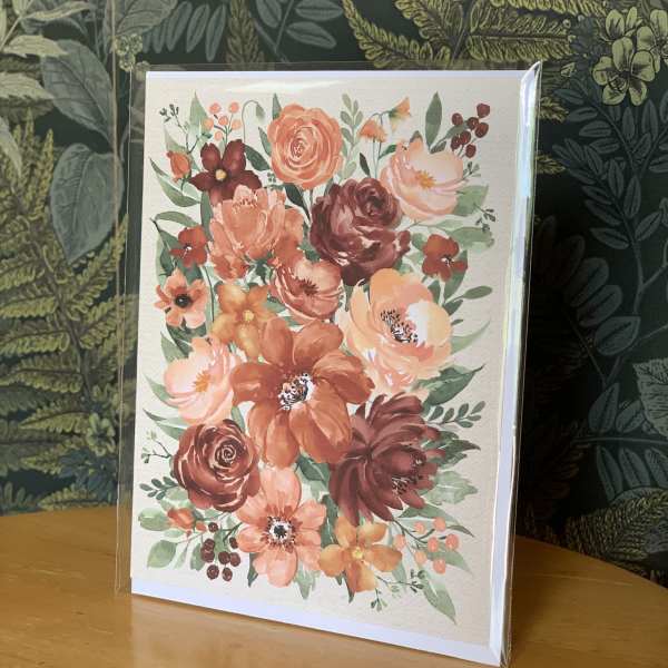 Floral greeting card with peach and burgundy blossoms