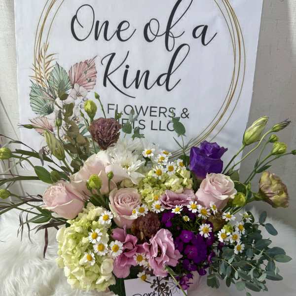 Mixed bouquet of pink, purple, white, and green flowers