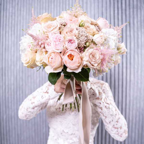 Large blush and ivory rose bouquet with a satin ribbon