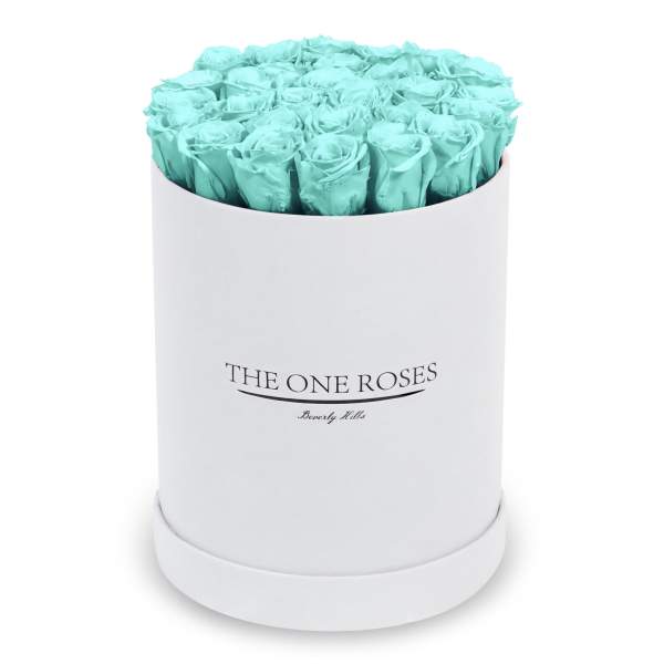 Turquoise roses arranged in a white round box