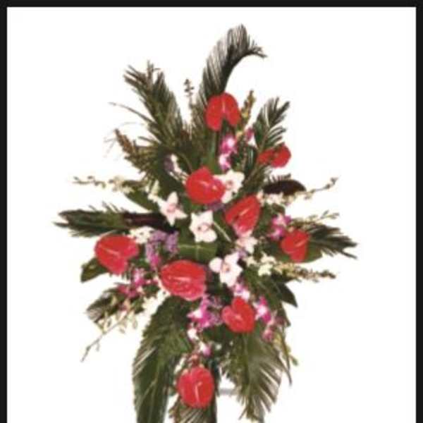 Standing floral spray with red anthuriums and pink accents
