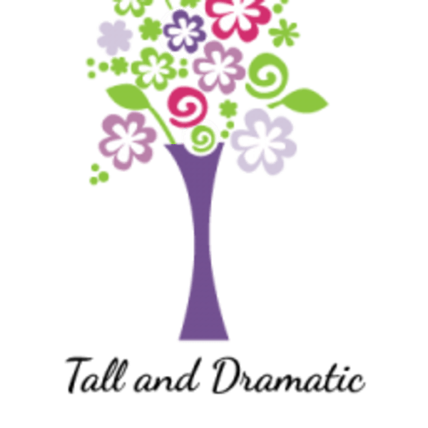 Stylized bouquet of colorful flowers in a purple vase