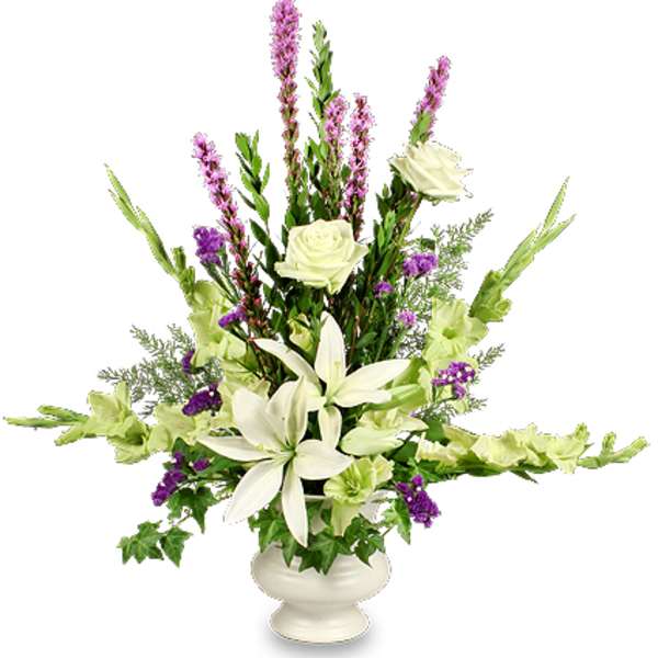 White lilies and roses in a white urn with purple accents