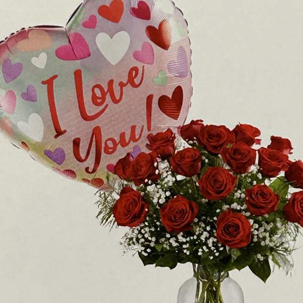 Red rose bouquet in a glass vase with a heart-shaped "I Love You" balloon