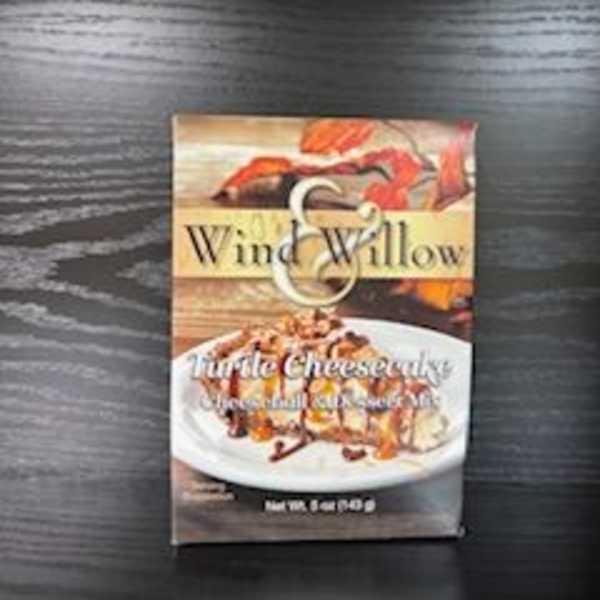 Box of Wind & Willow turtle cheesecake mix on a dark table