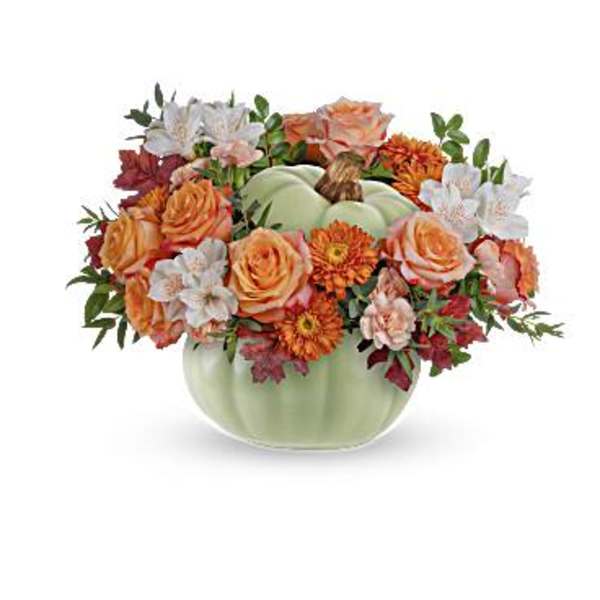 Pumpkin-shaped vase with orange and white flowers