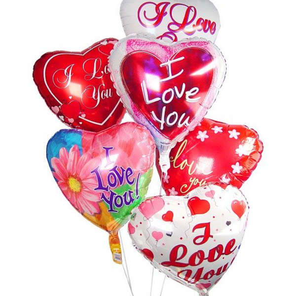 Cluster of heart-shaped balloons with love messages and floral print
