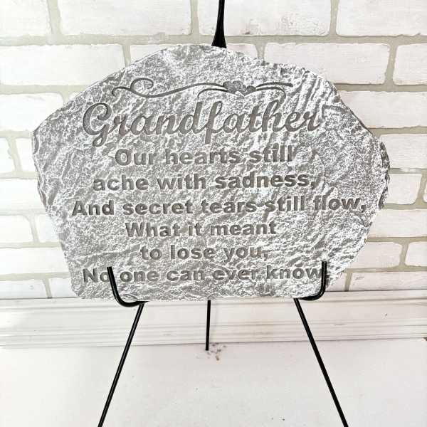 Memorial plaque on a black easel with a sympathy message