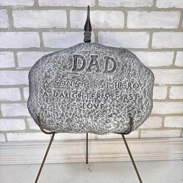 Memorial stone on a metal stand with engraved text for Dad