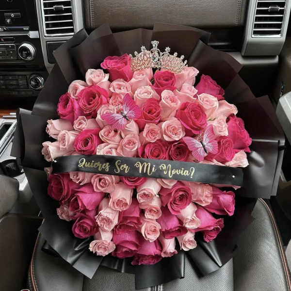 Bouquet of pink roses with a tiara and butterfly accents