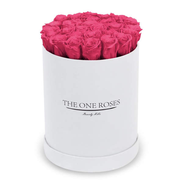 Hot pink roses arranged in a white round box