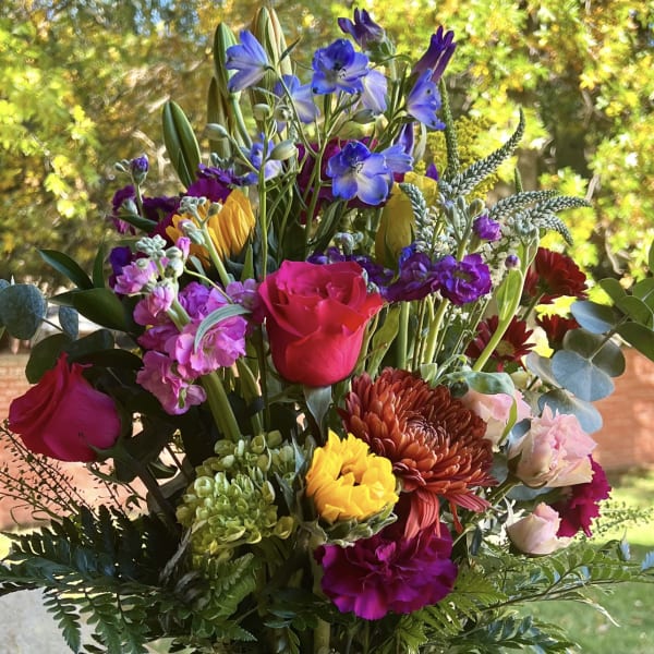 Colorful mixed bouquet in a clear glass vase