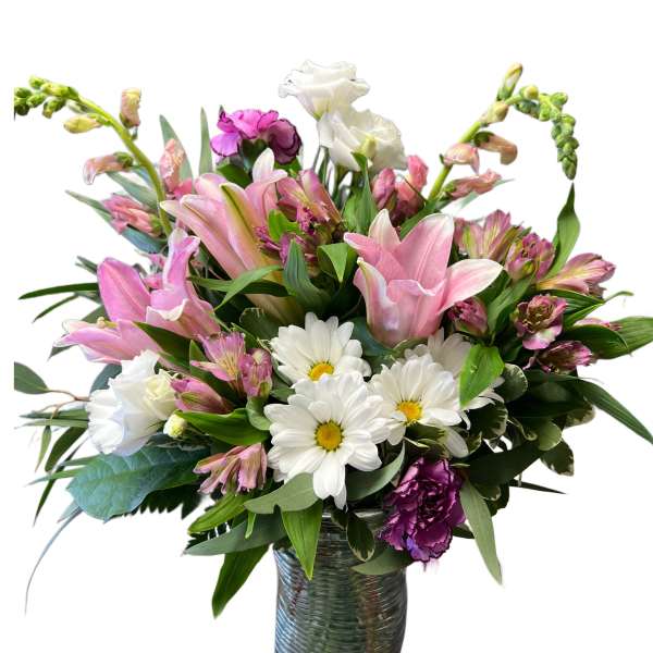 Pink lilies and white daisies in a glass vase