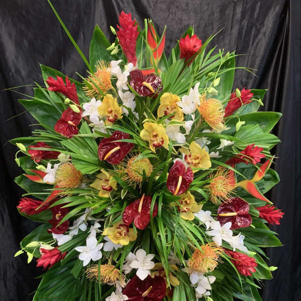 Large tropical standing spray with red, yellow, and white flowers