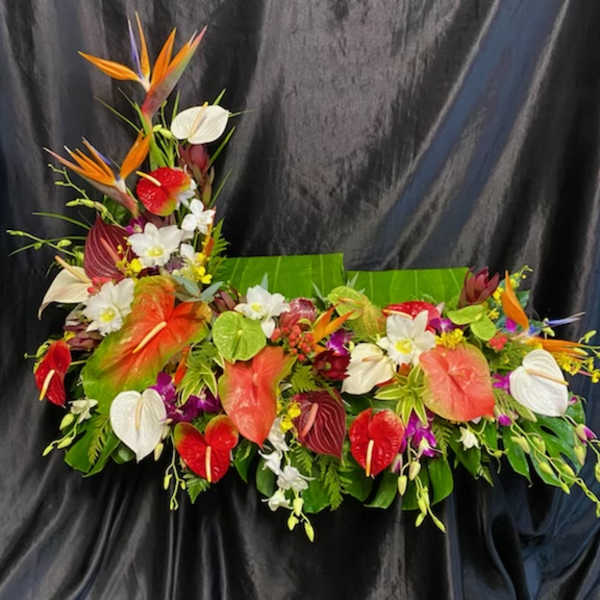 Tropical floral arrangement with anthuriums and bird of paradise