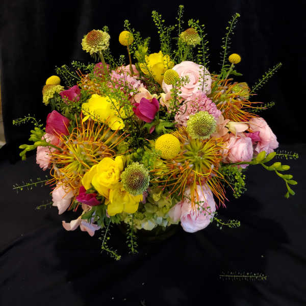 Colorful mixed bouquet with pink, yellow, and orange flowers