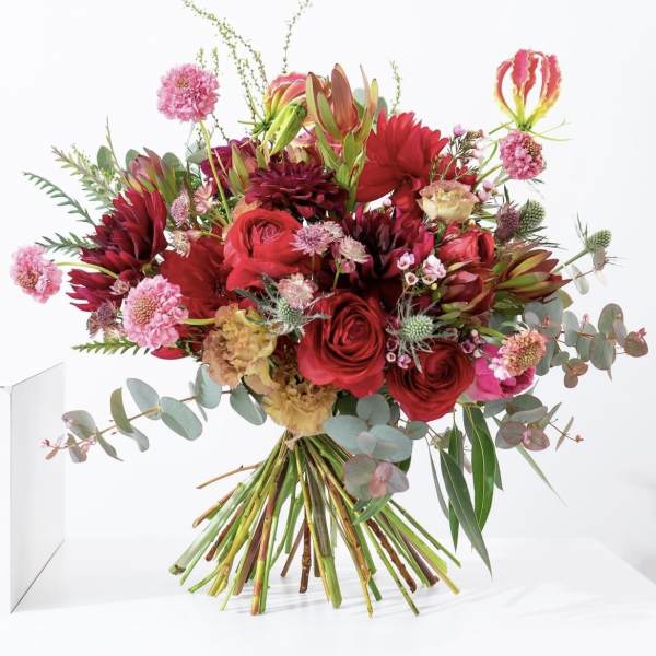 Bouquet of red and pink flowers with eucalyptus