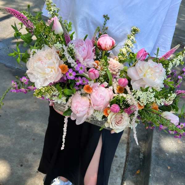 Large pastel bouquet with pink and white flowers in a rectangular container