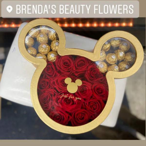 Mickey Mouse-shaped box filled with red roses and gold-wrapped chocolates