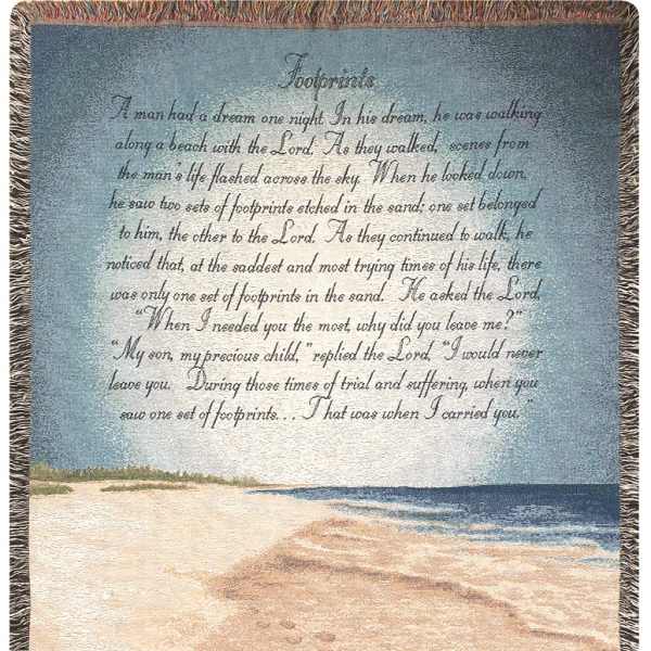 A woven blanket with a beach scene and printed poem text