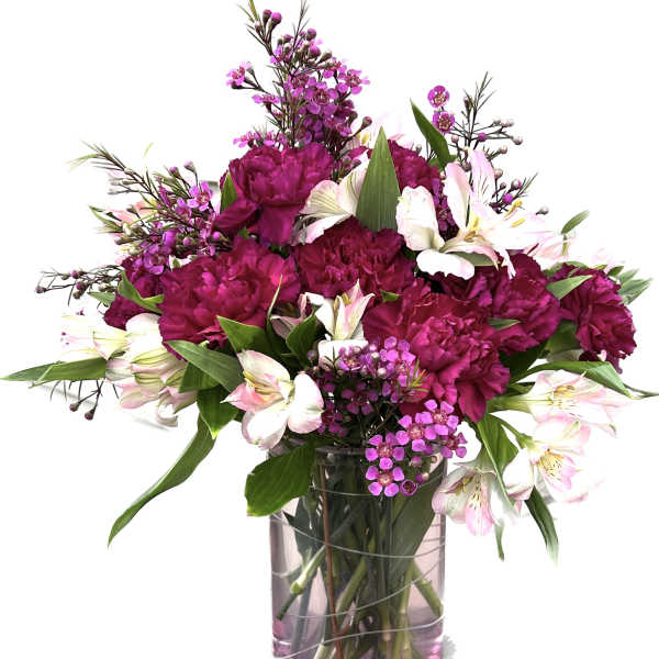 Pink and white bouquet in a clear glass vase