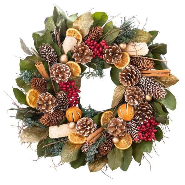 Holiday wreath with pinecones, dried orange slices, cinnamon sticks, and berries