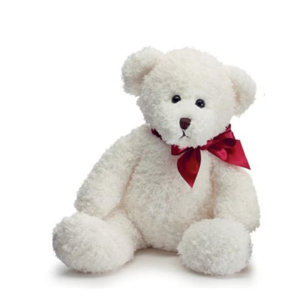 White teddy bear with a red ribbon bow