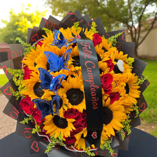 Bouquet of sunflowers and red roses with blue butterfly decorations