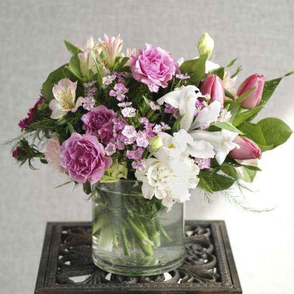 Pink and white mixed bouquet in a clear glass vase