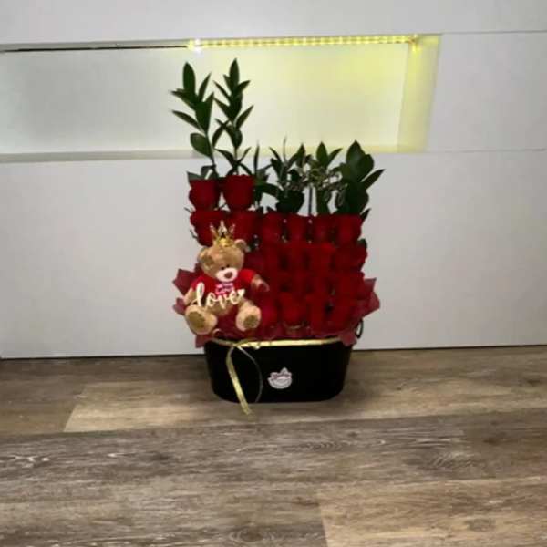 BEAUTIFUL DETAIL OF NATURAL ROSES WITH TEDDY BEAR