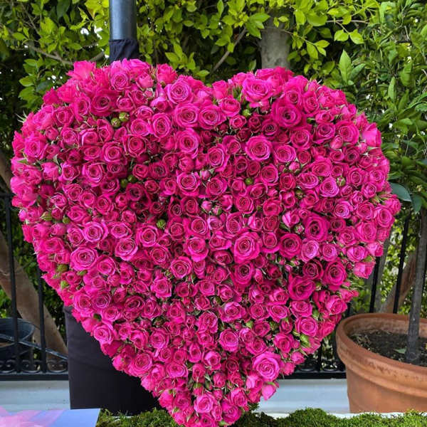 Heart-shaped arrangement of hot pink roses
