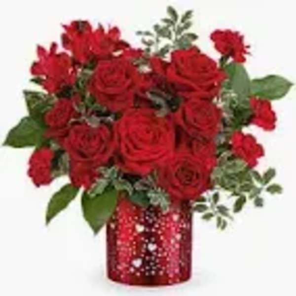 Red rose bouquet in a red patterned vase