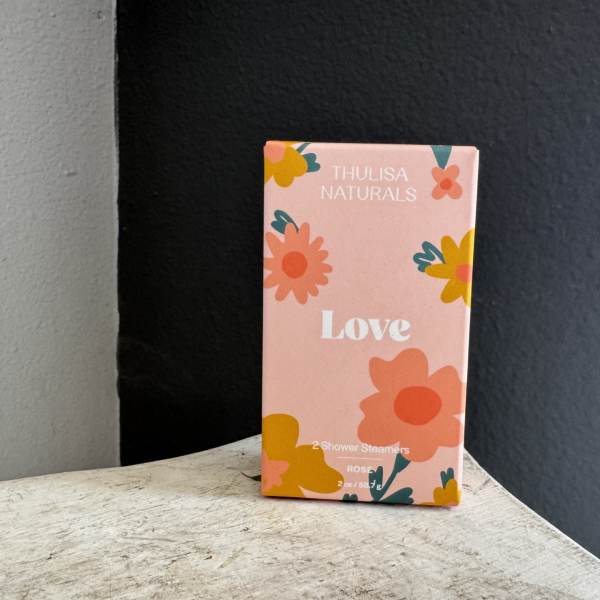 Pink floral product box labeled Love by Thulisa Naturals