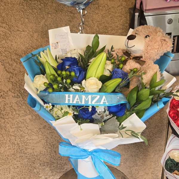 Blue and white bouquet with a teddy bear and baby boy balloon
