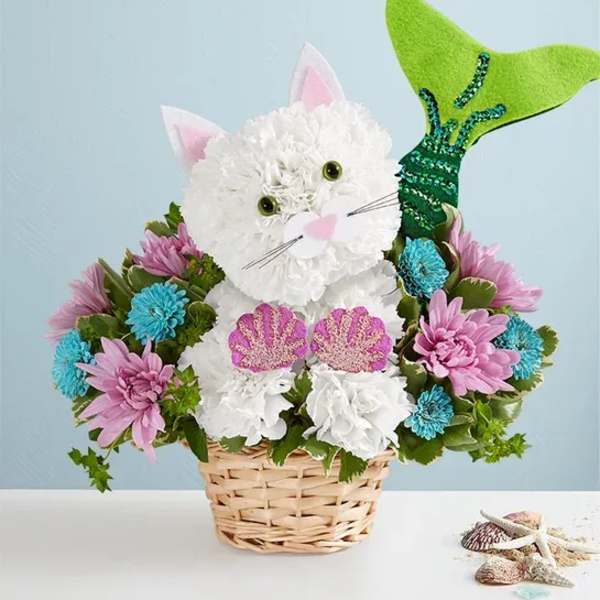 Basket arrangement shaped like a white cat with pink ears and a green tail