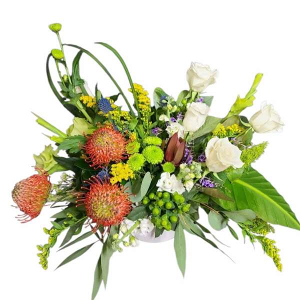 Mixed floral arrangement with white roses and orange pincushion blooms