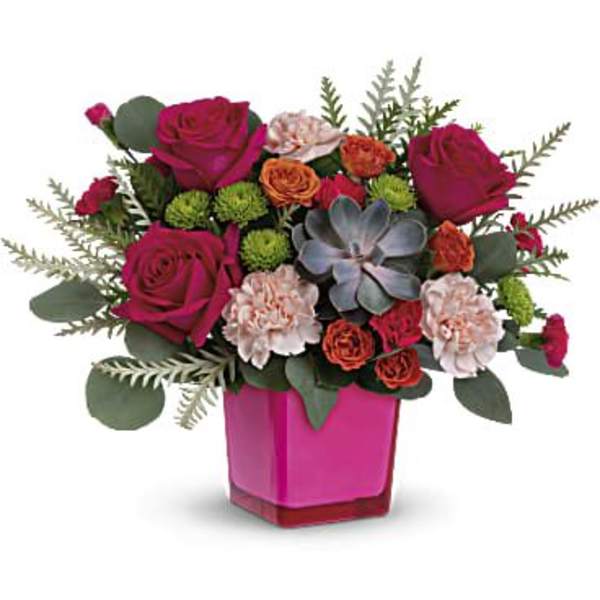 Pink roses and carnations arranged in a magenta vase