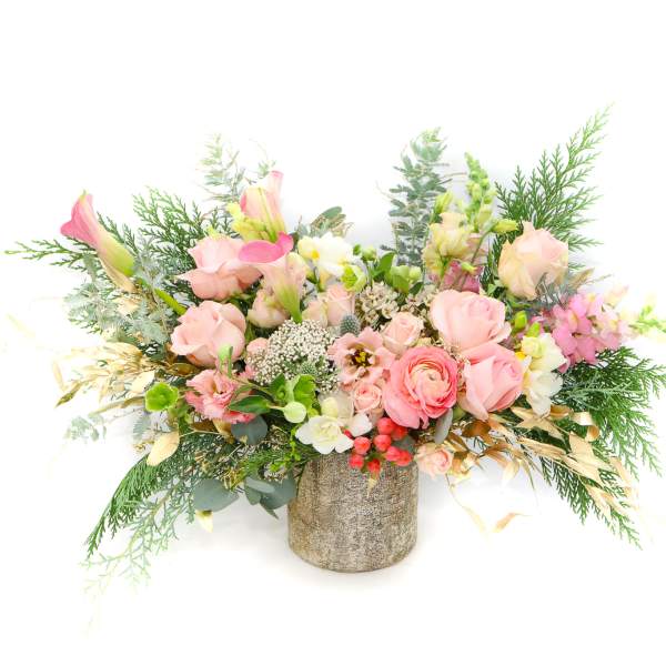 Pink and white floral arrangement in a textured vase