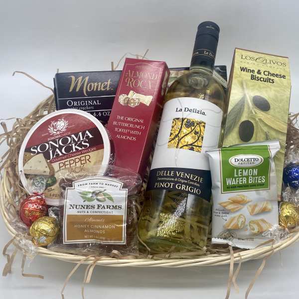 Gift basket with wine, crackers, cheese, nuts, and chocolates