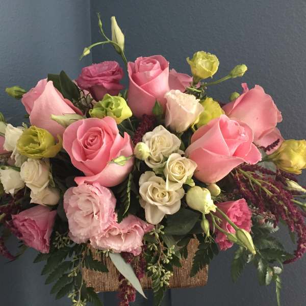 Bouquet of pink and white roses with green and yellow blooms