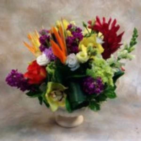 Colorful mixed bouquet in a small vase