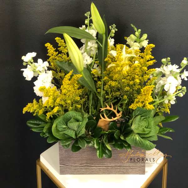 Yellow and white floral arrangement in a rectangular box