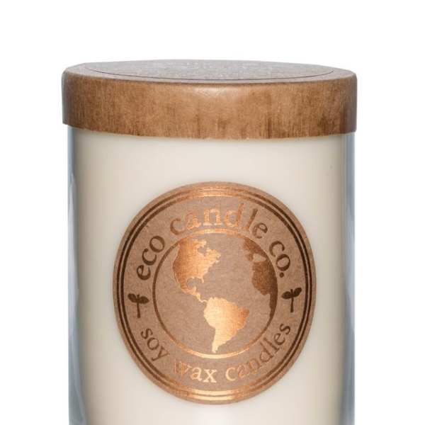 Soy wax candle in a glass jar with a wooden lid