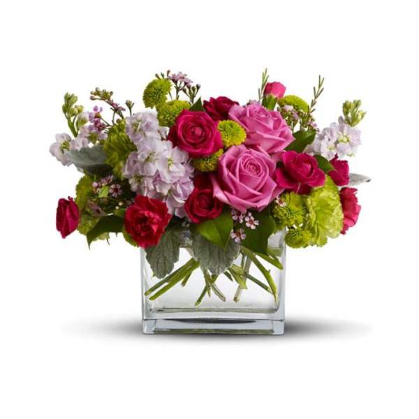 Pink and red roses in a clear glass vase