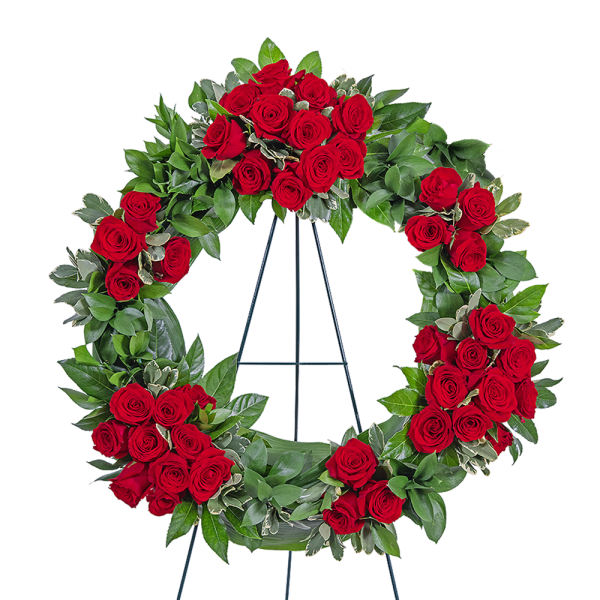 Red rose funeral wreath on a metal stand
