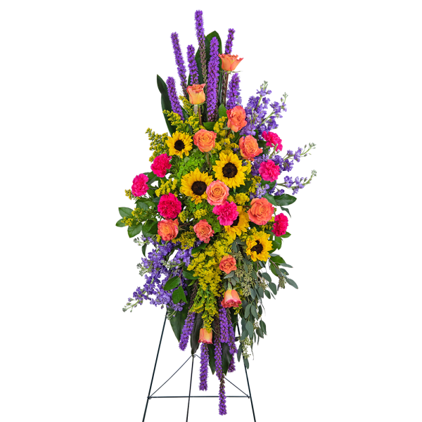 Tall standing floral spray with sunflowers, roses, and purple spikes